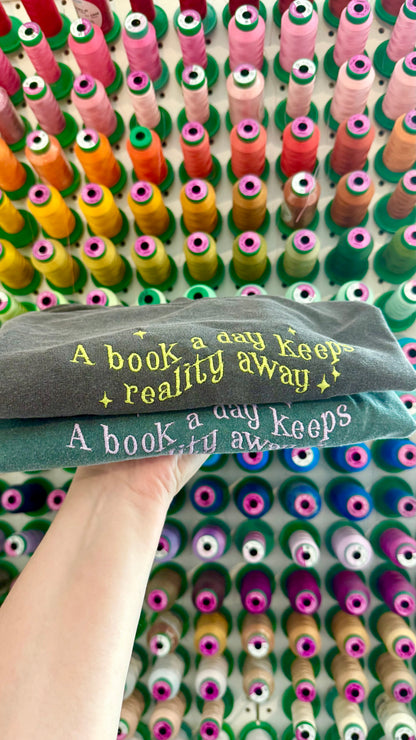 A Book a Day Keeps Reality Away Tee